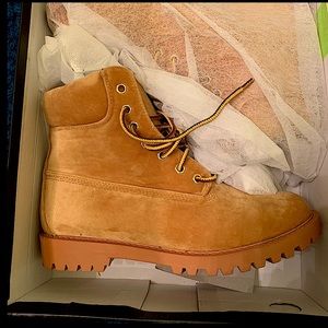 Suede material lace up boots. Stylish.